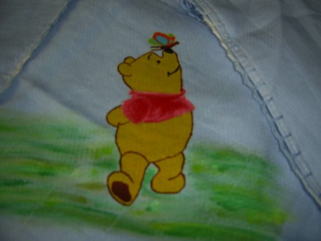 Winnie pintado á mão com ponto de croché á volta da fralda